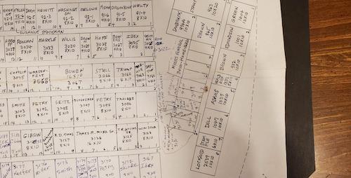 Paper cemetery map on table
